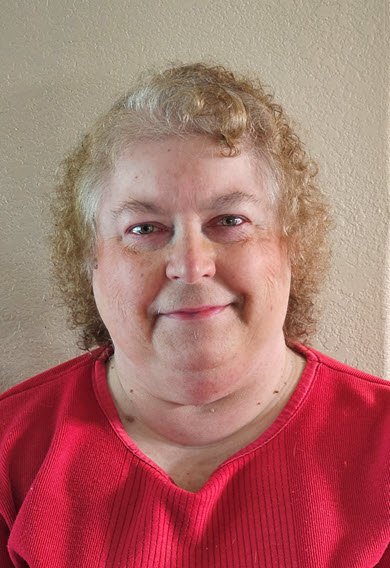 smiling treasurer Marsha Tisdale